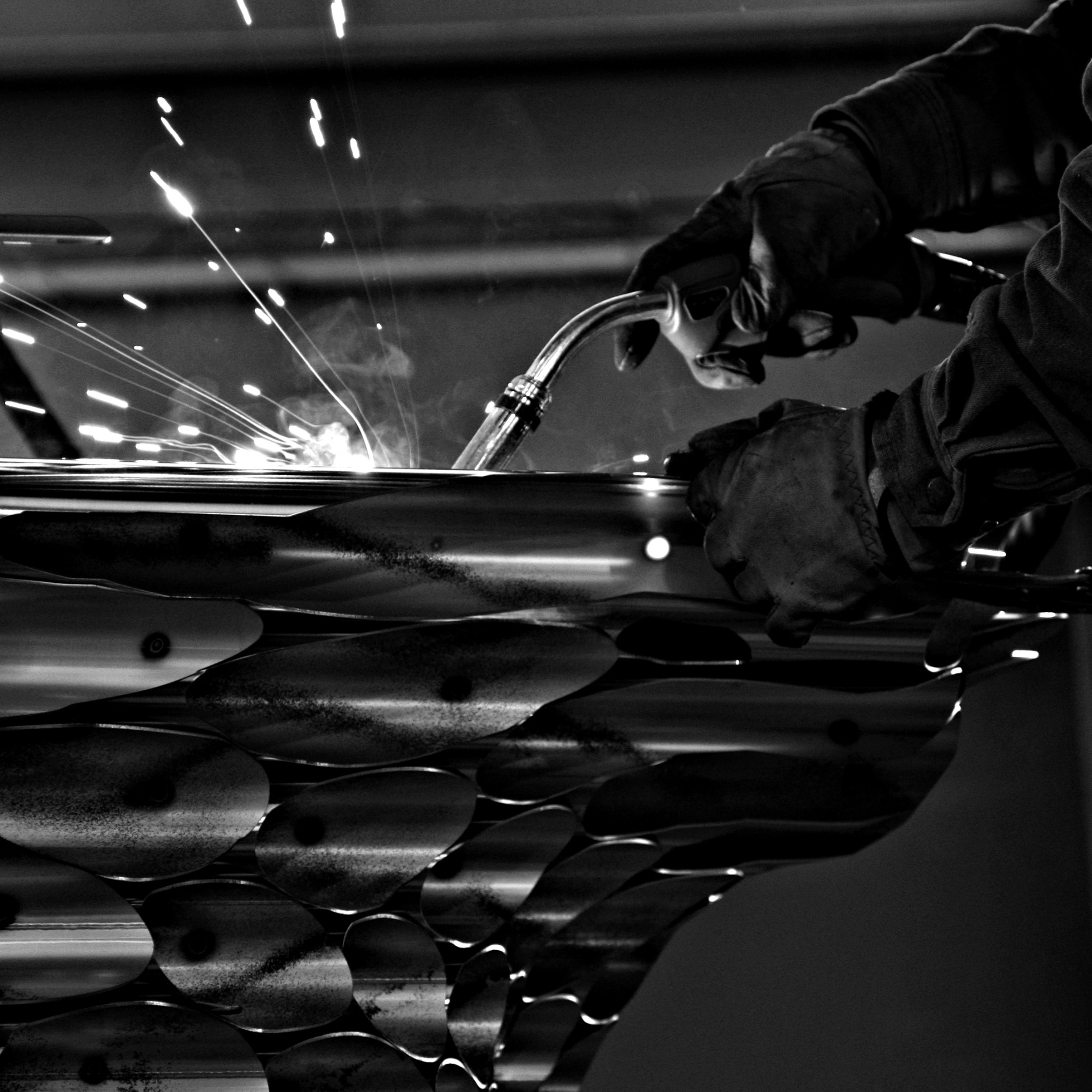 Welding a metal structure during artwork fabrication